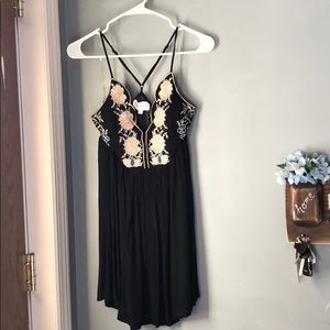 Mini black dress with floral design in front
